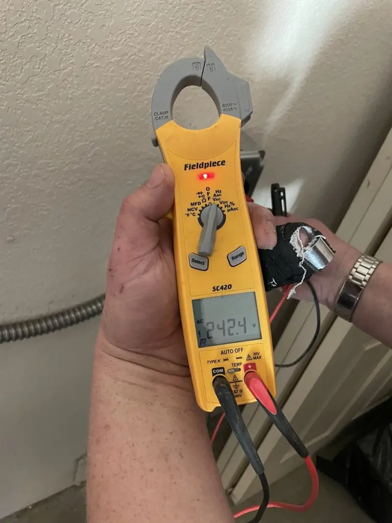 Voltage testing with clamp meter during Whole House Surge Protector in Cortlandville